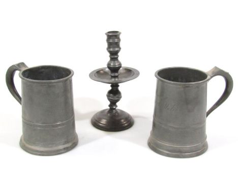 A 17thC style pewter candlestick, with turned stem and central dish holder and domed foot, 24cm high, an engraved pewter tank