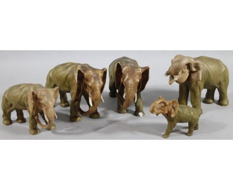 9Various Czechoslovakian Dux style and other elephant figures, to include one with trunk raised, 19cm high, one numbered, etc