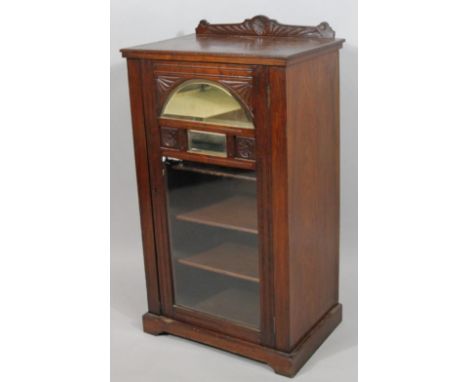 A late 19thC mahogany cabinet, with single glazed door with inset half moon mirror and four shelf interior shelving, 90cm hig