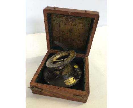 A reproduction boxed sundial compass.