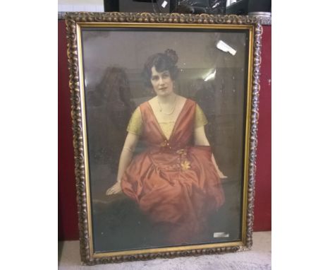 A large Edwardian coloured framed & glazed print of a seated lady.
