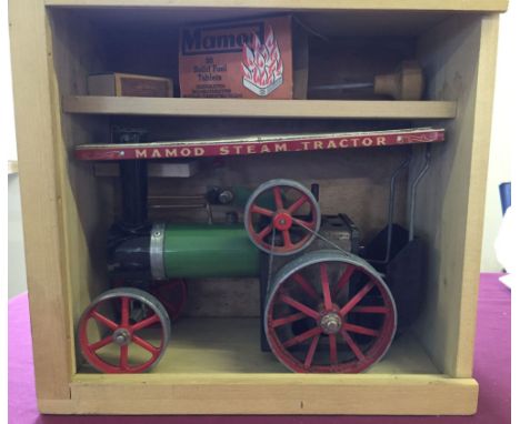 A wooden boxed Mamod steam tractor complete with fuel bricks