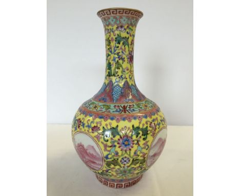 Chinese ceramic vase of mostly yellow & pink colouration (approx 26cm high).