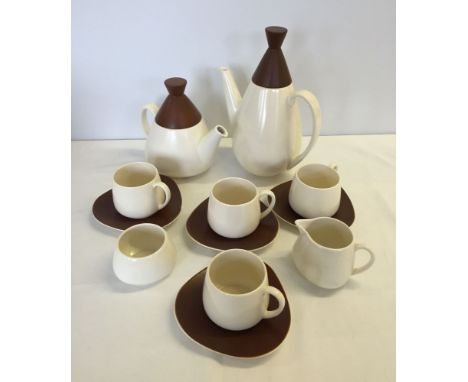 A Carlton ware brown & cream coffee pot, tea pot, sugar bowl, milk jug & 4 cups & saucers in retro design.