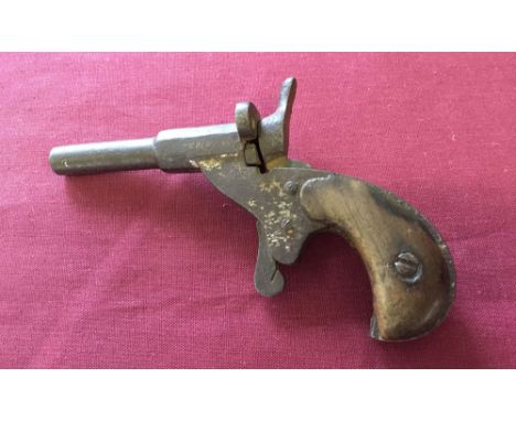 Vintage metal toy Deringer wooden handled gun. Marks on barrell 'Fritum'.