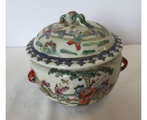 A Chinese ceramic lidded pot with beatle handle to lid.