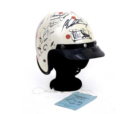 A signed helmet from the 1994 Grand Prix Mechanics Trust event at Silverstone,the white open-face Skidlid MkII helmet with bl