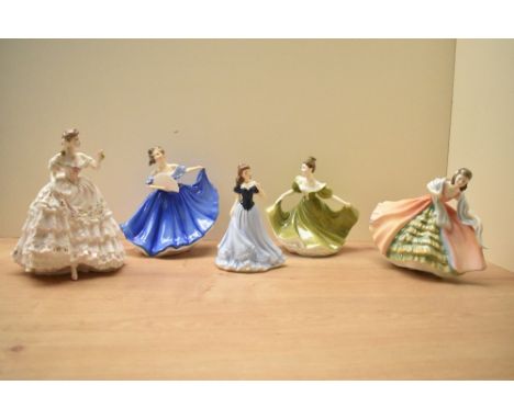 A group of three Royal Doulton bone china figurines comprising 'Elaine' HN 2791, 'Ann' HN 3259 and 'Lynne' HN 2329 sold along
