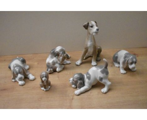 A group of six Lladro porcelain dog studies including 'Setter' model number 4583, 'Dog and Butterfly' model number 4917 and '