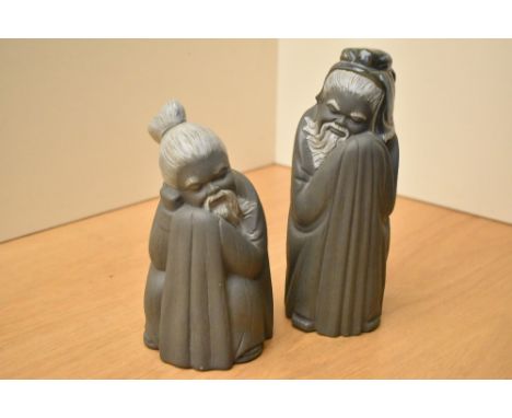 A pair of Lladro porcelain monks, model numbers 2056 and 2057, largest measures 21cm.