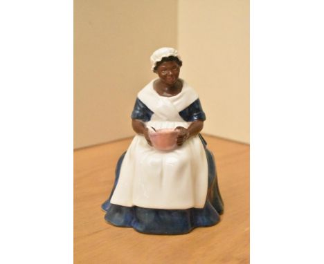 A Royal Doulton bone china figurine 'Royal Governor's Cook', model number HN 2233, measures 16cm.