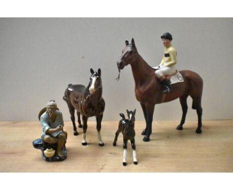 A Beswick Pottery study 'Arkle Pat Taaffe Up' model number 2084 by Arthur Gredington measuring 21cm, having damage to horse's