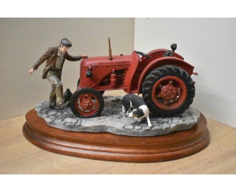 A Border Fine Arts exclusive figure group 'Kick Start' model number B0541, back of tractor is loose. Complete with box and ce