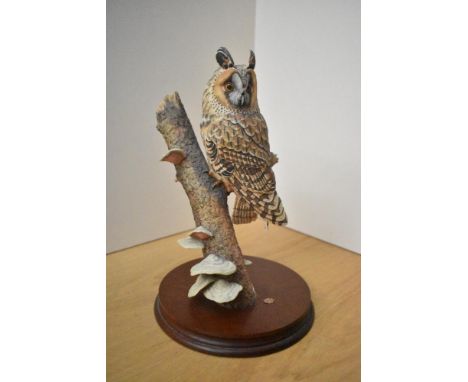 A Border Fine Arts 'Barn Owl' study, model number RB15 by Ray Ayres, measuring 30cm tall. Damage to tree trunk.