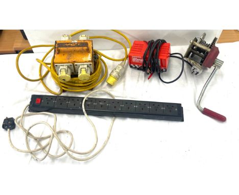 Selection of tools to include 110v transformer, multi extention box, Battery charger, hand winch etc 