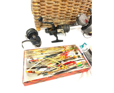 Vintage Wicker fishing basket with reels, floats, hooks etc, basket measures approx 12 inches tall 15inches wide 11 inches de