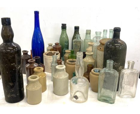 Large selection of vintage medicine bottles include glass and earthenware 