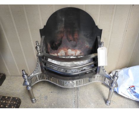 A Victorian design fire grate, the wrought iron back over polished chrome turned supports with coals