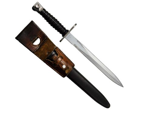 Swiss Army bayonet for the M 57 carbine, manufactured by SIG Waffenfabrik Neuhausen. The bayonet is complete with a plastic s