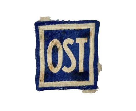 Printed patch OST - Ostarbeiter for forced laborers from the East working in Nazi Germany.Workers recruited from the areas of