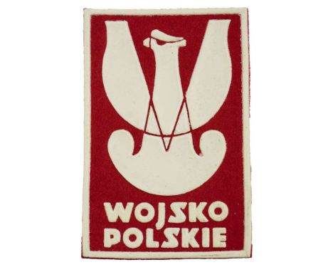 A patch in the form of a rectangle with a white frame, a rubberized eagle in the middle, and the inscription Wojsko Polskie b