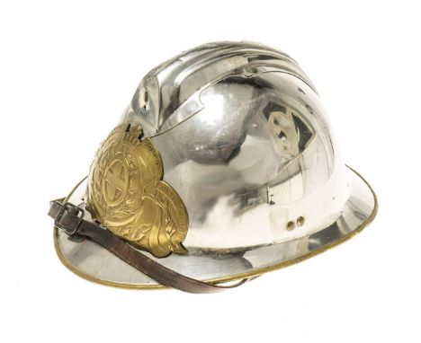 Nickel-plated helmet with a comb on the top of the head. A brass emblem of the Marine Firefighters from Marseille is visible 
