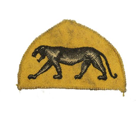 A triangular patch in the form of a black puma on a yellow background, the symbol of the 14th Greater Poland Armored Brigade,