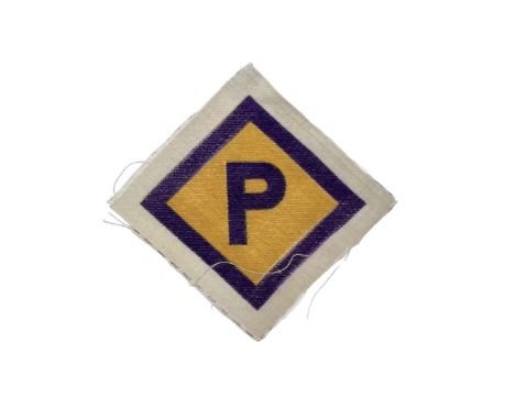 A forced laborer's patch from the Third Reich in the form of a square with the letter P inscribed on a yellow background.Gene