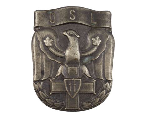 One-piece badge made of white metal, oxidized. A badge in the shape of a shield shield with a stylized eagle leaning its talo