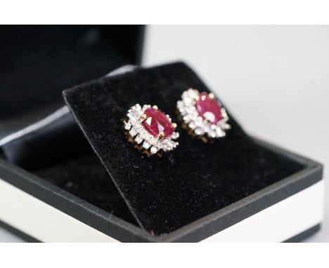 Pair of 14ct yellow gold ruby and diamond cluster earrings 