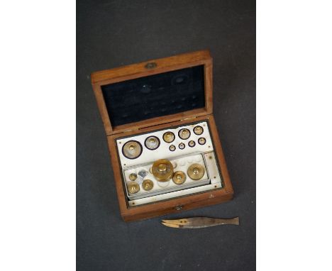 A boxed set of vintage brass weights. 