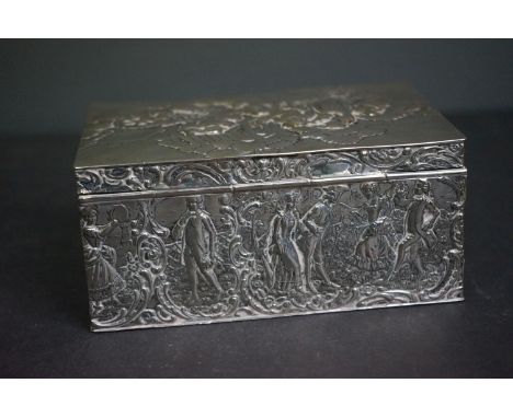 A silver plated cigarette box with ornate repousse design to sides and top. 