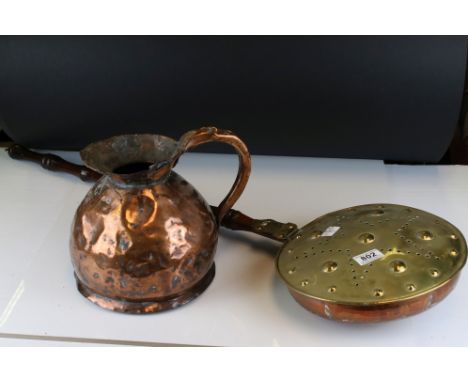 A vintage brass Bed warmer together with a copper gallon jug 