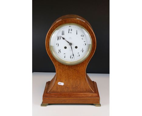 Edwardian Oak Inlaid Waisted Mantle Clock, the circular white face marked ' Dent, Royal Exchange ', with key, 38cms high 
