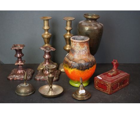 A box of mixed collectables to include a brass chamber stick, ceramic jug and silver plated candlesticks. 