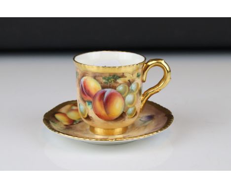 A contemporary Royal Worcester cup and saucer with fruit decoration signed F Roberts. 
