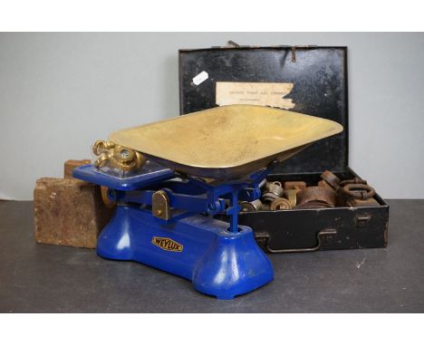 A set of vintage scales with weights together with a metal first aid box and various weights. 