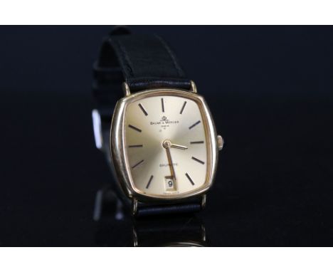 A 18ct gold cased gents Baume &amp; Mercier Baumatic watch with date marker to 6pm. 