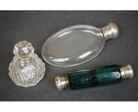 A collection of three vintage scent bottles to include a green glass double ended example and a silver collared example. 
