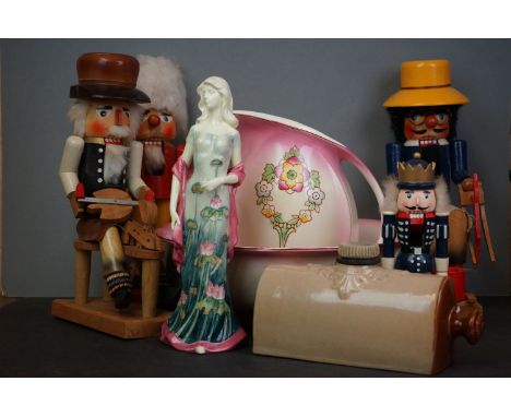 A collection of four figural vintage wooden nutcrackers together with a Benaya tube lined figurine, a jug and basin and a hot