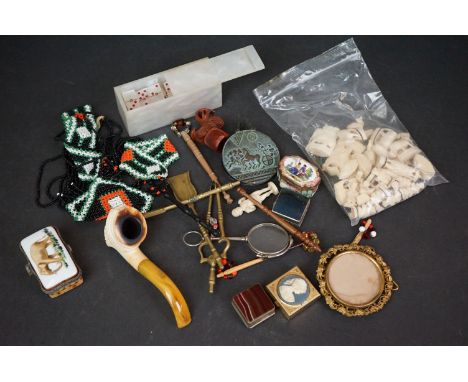 A box of mixed collectables to include a meerschaum pipe, pill boxes and bobbins.