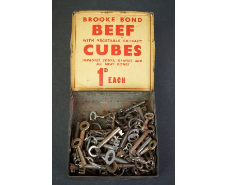 Quantity of smaller caddy/box keys in a Brooke Bond tin 