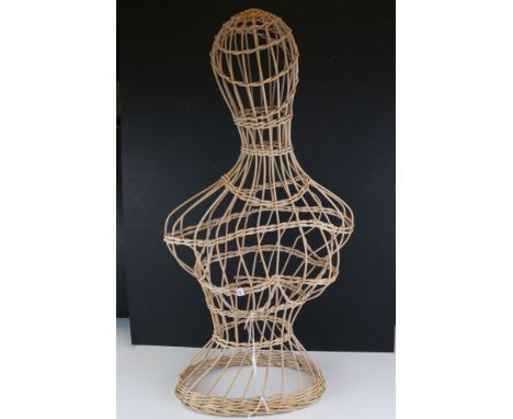 A woven wicker female mannequin. 
