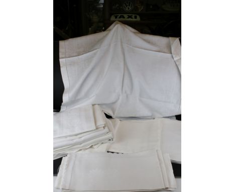 A collection of vintage linen table cloths. 