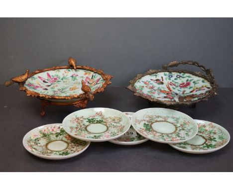 Two Chinese Famille Rose Porcelain Plates with enamel decoration of birds and butterflies, one mounted in an ornate metal sta