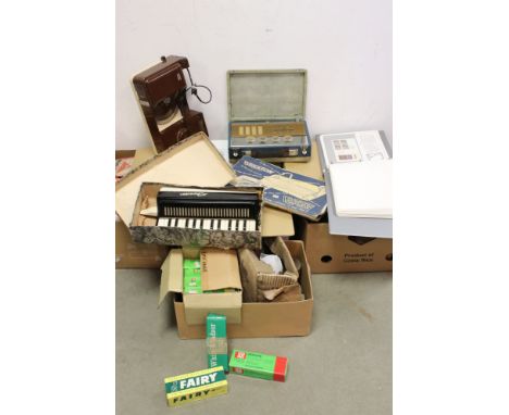 A large group of mixed collectables contained within four boxes to include a vintage radio, a quantity of mid century boxed c