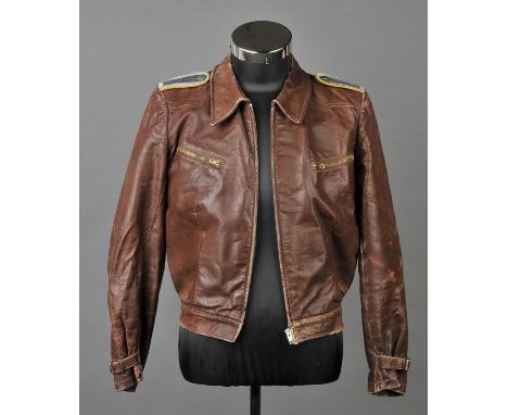 *Third Reich. A private purchase fighter pilot's jacket,  with grey and silver bullion epaulettes and yellow piping, 'Orig. R