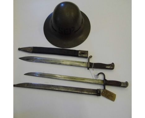 *Bayonets. A WWI German Mauser bayonet,  the 37cm blade stamped 'Weyerberg Kirschbaum & Cie Solingen', wooden grip and hooked