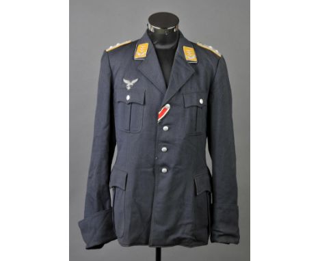 *Third Reich. A Fallschirmjager (Paratroopers) officer's jacket,  with silver bullion epaulettes and insignia with yellow col