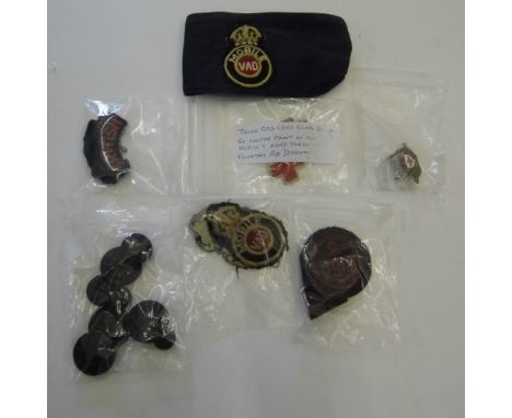 *WWI. A small collection of WWI V.A.D. Nursing insignia,  comprising a cloth armband with embroidered V.A.D. emblem, a Royal 